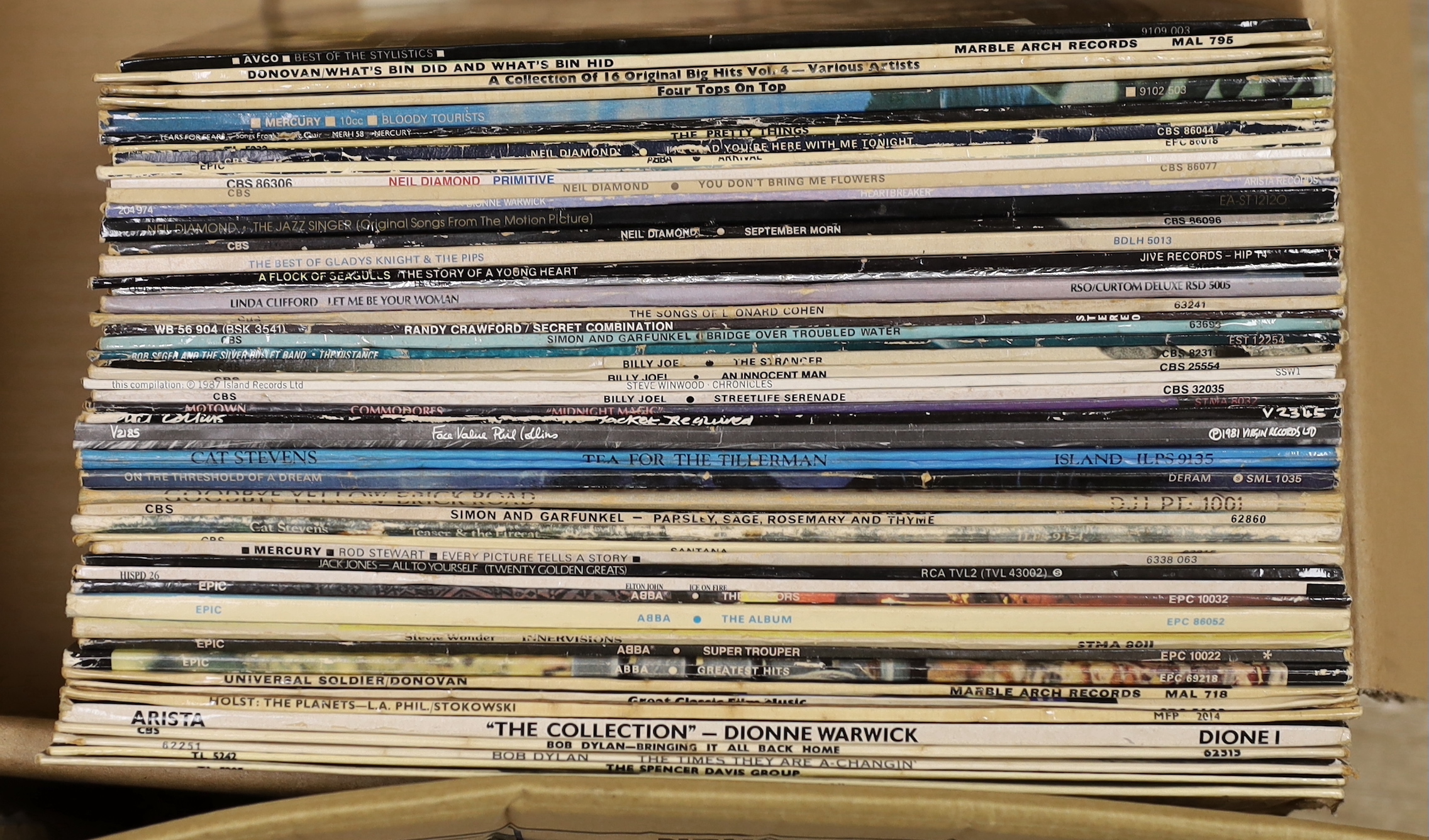 Ninety-five mainly 1970's and 80's LPs including Paul McCartney, Cream, Jeff Beck, Santana, U2, Neil Diamond, ELO, 10cc, Queen, Billy Joel, Elton John, Bob Dylan, The Spencer Davis Group, etc. Plus a quantity of 7 inch s